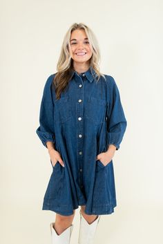 Collared Pockets at bust and side Long sleeves with elastic cuffs Lightweight Non-sheer 100% Cotton SIZES: SMALL MEDIUM LARGE Game day or concert, this denim dress has got your back. Featuring a full button-up front and long sleeves, this mini dress is perfect for any fall event. Pair with boots and a hat for a country vibe, or sneakers for a sporty look. SIZE XS S M L XL 2XL 3XL FITS A SIZE 00-0 2-4 6-8 10-12 14-16 18-20 22-24 Fall Dark Wash Dresses With Pockets, Medium Wash Button-up Dress For Daywear, Denim Blue Relaxed Fit Dress For Fall, Dark Wash Long Sleeve Washed Dress, Relaxed Fit Denim Blue Dress For Fall, Relaxed Fit Denim Dresses For Fall, Spring Denim Dress With Relaxed Fit And Button Closure, Long-sleeve Denim Dress For Casual Spring Wear, Spring Denim Dress With Button Closure And Relaxed Fit