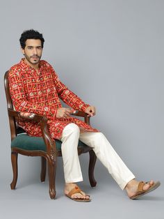 VASTRAMAY Men's Red Patola Print Ethnic Kurta Pyjama Set Elevate your ethnic wear collection with this classic kurta pyjama set. Features a red Patola print kurta with a mandarin collar, full sleeves, and knee length. Paired with comfortable cream colored viscose pants with an elasticated waistband. Perfect for festive occasions and family gatherings. Key Features Red Patola print ethnic kurta Mandarin collar Full sleeves Knee length Cream colored viscose pyjama Elasticated waistband Specificati Patola Print, Kurta Cotton, Kurta Pyjama, Sleeveless Jacket, Cotton Pyjamas, Hot Outfits, Full Sleeves, Pyjama Set, Family Gatherings