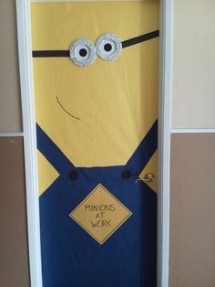 a door decorated to look like a minion with the words minionss work on it