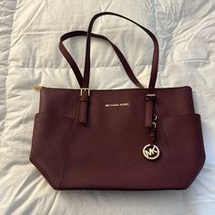 Nwot Michael Kors Purse/Handbag Condition: Excellent, Never Used Color: Maroon Measurements: Shown In Pictures Comes With Duster Bag (As Pictured) Elegant Michael Kors Travel Bags, Michael Kors Burgundy Shopping Bags, Everyday Burgundy Bag With Gold-tone Hardware, Burgundy Travel Bags With Gold-tone Hardware, Burgundy Bags With Branded Hardware For Daily Use, Burgundy Shoulder Bag With Gold-tone Hardware For Shopping, Michael Kors Large Capacity Shoulder Bag For Errands, Shopping Bags With Branded Hardware In Burgundy, Burgundy Bag With Branded Hardware