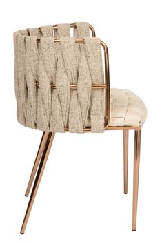 a beige chair with gold metal legs and a white seat cushion on the back side