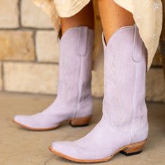 The KARIMA cowgirl boot for women is a gorgeous addition to any ensemble. Made of soft, luxurious suede in a beautiful lilac color, you'll feel pretty and confident every time you slip them on. Perfect for any occasion, these boots will make a statement wherever you go. Purple Snip Toe Boots For Fall, Fitted Purple Western Boots, Fitted Western Purple Boots, Purple Leather Spring Boots, Spring Purple Leather Boots, Chic Purple Boots For Fall, Purple Cowgirl Boots, Purple Cowboy Boots, Boot For Women