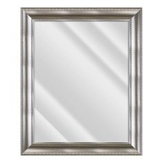 a silver framed mirror on a white background