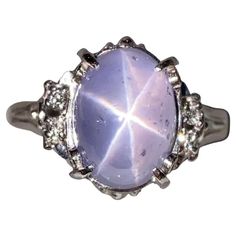 This is a very simple design aiming to give the Start Sapphire Cabochon as much attention as possible. The clearer the asterisks is on the star sapphire the more valuable it is. Main Star Sapphire weight is 7.53ct Total Natural Diamond weight is US RIng Size is 7 1/2 , The Inner Dismeter of the Ring is 17.73mm Star Saphire Ring, Star Sapphire Ring Purple, Star Saphires, Star Sapphire Ring Vintage, Star Sapphire Engagement Ring, Wizard Jewelry, Star Sapphire Gemstone, Blue Star Sapphire Ring, Grey Sapphire