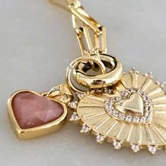 Say goodbye to small hearts and hello to BIG love with Emma - a luxe look for less! This oversized heart charm necklace in gold + silver with CZ stones makes a bold fashion statement without breaking your budget. Add extra charms to create your own unique look. Rose Gold Plated Charm Necklaces With Heart Charm, Rose Gold Plated Heart Charm Necklaces, Rose Gold Heart Charm Necklace, Gold Plated, Rose Gold Plated Charm Necklace With Heart Charm, Gold Plated Heart Charm Necklaces With Lobster Clasp, Gold Plated Heart Charm Dangle Necklace, Gold Dangle Heart Necklace With Charm, Heart-shaped Gold Plated Charm Necklace With Lobster Clasp, Everyday Gold Plated Heart Charm Necklaces