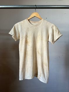 "Vintage military cotton T-shirt with name stencil on the bottom. Has lots of stain and wear.  Measurements flat: 15\" Pit to Pit  22\" Length  All sales final, Please ask any questions before buying! Thanks!" Cotton Short Sleeve T-shirt, Vintage Faded And Bleached Tops, Cotton T-shirt With Natural Dye And Short Sleeves, Acid Wash Crew Neck T-shirt With Natural Dye, Vintage Faded Bleached Tops, Vintage Bleached Faded Top, Short Sleeve Cotton T-shirt With Natural Dye, Crew Neck Cotton T-shirt With Natural Dye, Vintage Distressed Cotton Shirt