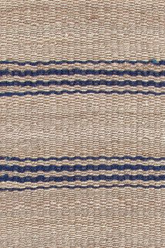 an area rug with blue and beige stripes