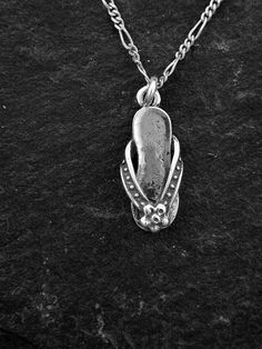 "This solid 3 Dimensional Flip-Flop Shoe pendant is Sterling Silver. The included chain is a Sterling Silver Figaro 50 chain. You may choose 16, 18 or 20 inch at the same price. Other length available at sightly higher prices. The Flip-Flop pendant measures 1\" by 7/16\" across. I hand cast all my pieces using the lost wax casting method. Please ask your needs. You may call me with questions, often I am out so please use my machine. 831-476-3176. You may also call using your credit card directly Silver Chain Necklaces For The Beach, Silver Chain Necklace For Beach, Silver Flip Flops, Orchid Necklace, Silver Heart Earrings, Wax Casting, Lost Wax Casting, Flip Flop Shoes, French Wire