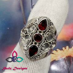 Garnet Ring, Designer Ring, 925 Sterling Silver Ring, Unique Ring, Women Gemstone Ring, Red Stone Ring, Designer Ring, Wedding Ring, Rings Gemstone - Garnet Weight- 12.1gm Stone Size- 5x7m, 5mm Metal - 925 Sterling Silver This item is made to order.  We will make the item in 3 to 5 business days after confirmation of order and will be shipped directly from India.  The pictured gemstone will not be sent, we will pick similar  gemstone to make your order. Gemstones are natural and each stone can v Red Stone Setting Rings For Wedding, Red Wedding Rings With Stone Setting, Red Gemstone Rings In Sterling Silver, Red Crystal Ring With Stone Setting For Anniversary, Red Ruby Rings With Stone Setting, Red Gemstone Stackable Rings For Formal Occasions, Formal Red Stackable Gemstone Rings, Red Crystal Ring With Stone Setting For Promise, Adjustable Red Gemstone Rings