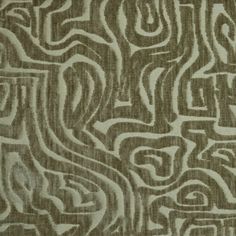 a brown and white fabric with an abstract design on the front, in shades of grey