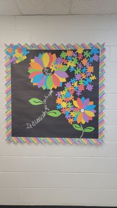 a bulletin board with colorful flowers on it