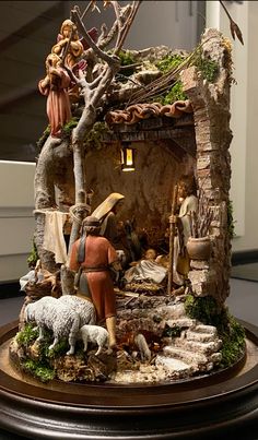 a nativity scene with figurines and lights