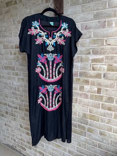 🍉so pretty.  Embroidery on front  Rayon dress is black.  🍉label: see tag  Best for s/m  Rayon  Bust: 44" Waist:44" Hip:46" Length:45" 🍉great cindition Black Hippie Dress For Vacation, Black Hippie Vacation Dress, Traditional Black Dress For Vacation, Summer Black Kaftan With Floral Embroidery, Embroidered Black Kaftan For Spring, Black Embroidered Kaftan For Spring, Black Bohemian Kaftan With Floral Embroidery, Black Floral Embroidered Kaftan For Festivals, Black Short Sleeve Kaftan For Vacation