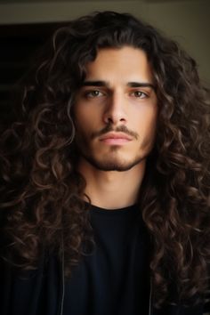 Long curls with a boost of volume are an ideal look for men with curly hair who want to make the most of their natural curls. By using styling foam you can give your curls a bounce making this long hairstyle stand out. Click here to check out more irresistible long hairstyles for men. Long Hair Styles Men Curly, Long Curly Hair Men, Mens Perm, Men With Curly Hair, Brown Curly Hair, Curls For Long Hair