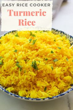 a bowl filled with yellow rice next to a sign that says easy rice cooker turmeric rice