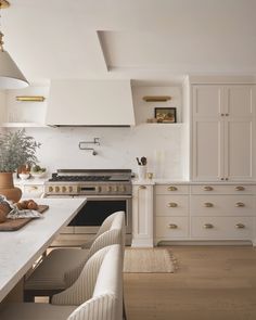 a kitchen with an oven, stove and counter tops in it's center island