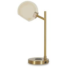 a gold table lamp with a glass shade on it's base and a round light bulb