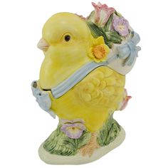 a yellow bird figurine with flowers around its neck