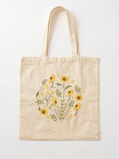 a tote bag with red flowers and leaves on it