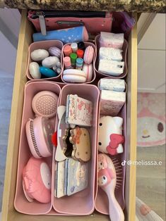 the drawer is filled with various items for babys to use in their playroom