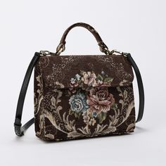 With a nod to the Victorian era, MCW's freshly combines the classic and elegant design of the traditional carpet satchel with a textural and tactile twist. This exquisite top handle satchel is a perfect blend of style and practicality. Spacious interior with zipper and slip pockets, detachable shoulder strap. Sturdy exterior in carpet or velvet, cotton lining. Convenient magnetic flap closure, brass feet for stability. Features: * Detachable, adjustable shoulder strap * Magnetic flap for easy access * Interior slip and zipper pockets * Hand-polished brass hardware * Includes dust bag Dimensions: * Satchel size: 9.50"W x 4"D x 8"H * Adjustable shoulder strap: 43.50" to 51.15" Interior Pockets: * Zipper pocket: 7"W x 5"H * Slip pocket: 8"W x 5.50"H Weight: 1lb 5oz Traditional Carpet, Things I Need To Buy, The Victorian Era, Secret Sale, Weekend Getaway, Victorian Era, Easy Access, Purses And Handbags, Top Handle