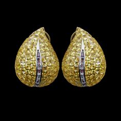 Invisible Setting earrings featuring semi precious canary yellow stone and cz diamonds in leaf shape. Ideal jewelry to pair with your bridal wedding gown or any special occasion outfit. These LUXUEY Earrings surely elevate your look. Perfect gift for her. *𝐏𝐑𝐎𝐃𝐔𝐂𝐓 𝐃𝐄𝐓𝐀𝐈𝐋* * 𝐌𝐚𝐭𝐞𝐫𝐢𝐚𝐥: Brass * 𝐏𝐥𝐚𝐭𝐢𝐧𝐠: White Rhodium Plated * 𝐒𝐭𝐨𝐧𝐞: AAA-quality CZ Yellow Diamond. *𝐃𝐈𝐌𝐄𝐍𝐒𝐈𝐎𝐍𝐒* * 𝐖𝐞𝐢𝐠𝐡𝐭: 9 gm each * 𝐋𝐞𝐧𝐠𝐭𝐡: 1.2 Inches * 𝐖𝐢𝐝𝐭𝐡:  0.8 Inches * Wedding Yellow Diamond Earrings With Accents, Yellow Diamond Earrings With Diamond Accents For Wedding, Yellow Diamond Earrings With Accents For Wedding, Formal Yellow Citrine Earrings, Luxury Yellow Diamond Drop Earrings, Yellow Diamond Accented Earrings For Anniversary, Yellow Earrings With Diamond Accents For Anniversary, Yellow Diamond Accent Earrings For Anniversary, Yellow Citrine Earrings For Formal Occasions