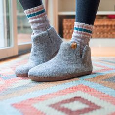 Handmade by artisans in Nepal using traditional crafting techniques, Baabushka's superbly cozy felt booties are made with sheep’s wool, water, and organic soap. The result is soft yet durable footwear that provides wonderful warmth and comfort. The bootie conforms to the contours of your foot and comes up past your ankle, ensuring a comfortable fit that doesn’t slip off. Felted wool naturally insulates, yet allows your skin to breathe, which means you can enjoy wearing your Baabushka booties yea Felt Booties, Cozy At Home, Sandals Outfit, Home Slippers, Wool Slippers, Felted Slippers, Slippers Cozy, Organic Soap, Buffalo Leather