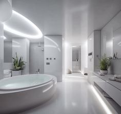 a large white bathroom with an oval bathtub in the center and plant on the counter