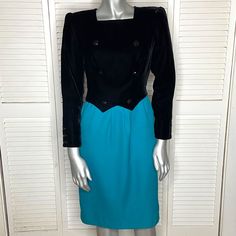 Vintage 1980s Valentino Boutique Structured Shoulder Dress. Rich Black Velvet Bodice Meets Vibrant Teal Blue Wool Skirt. Structured Shoulders For A Powerful, Dramatic Look, Bust Is Accented With Faceted Buttons (Faux Double Breasted Look) Which Also Adorn Sleeve Cuffs. Rear Zip Closure, Fully Lined. Knee-Length: Classic Cut For Formal Or Business Occasions. Made In Italy. Tagged Women's Size 6 But Please Note, May Run Slim Considering It's A Vintage Piece. Measurements: Bust 16 1/4" Waist 13.5" Hips 16 1/4" Length 38 3/4" Shoulder 14.5" Sleeve Length 22". Excellent Gently Used Condition: Beautifully Preserved, May Have Mild Signs Of Minimal Wear But Nothing Significant. Smoke Free Home. Dress Rich, Structured Shoulder, Dramatic Look, Wool Skirt, Wool Skirts, Blue Wool, Boutique Dresses, Teal Blue, Black Velvet