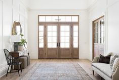 a living room filled with furniture and a large rug