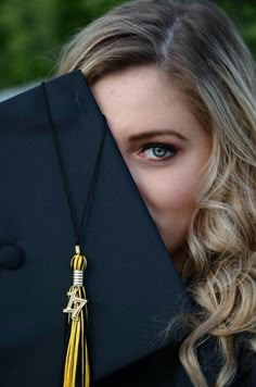 a woman wearing a graduation cap and tassel