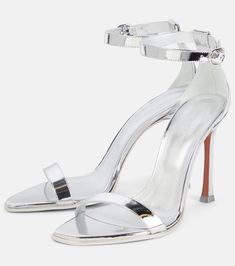 Sleek Silver Heels With Sculpted Heel, Metallic Heels With Heel Strap And Single Toe Strap, Formal Metallic Sandals With Sculpted Heel, Metallic Sandals With Sculpted Heel For Formal Occasions, Sleek Silver Heels With Padded Heel, Luxury Silver Sandals With Sculpted Heel, Modern Metallic Sandals With Sculpted Heel, Metallic Single Toe Strap Leather Heels, Metallic Sandals With Padded Heel And Pointed Toe