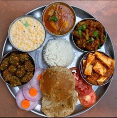 a metal plate topped with different types of food