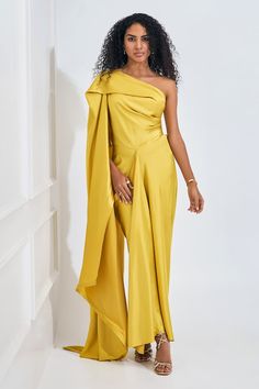 Electric yellow asymmetric dress featuring drape detailing with a flare trail on one side. - Aza Fashions Solid Color Outfits, Maxi Dress For Women, Yellow Satin, Asymmetric Dress, Indian Designer Wear, Indian Design, Asymmetrical Dress, Dress For Women, Womens Maxi Dresses