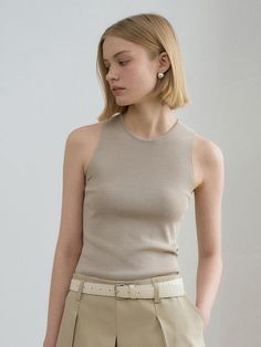 This is a trendy and feminine top by RENEJ that is made out of high quality and sturdy material. With distinctive mood of the design and comfortable wear, you can style it for your casual daily outfit.- Light and soft summer knit fabric- Basic round neckline- Unique and feminine mood Versatile Fitted Beige Tank Top, Fitted Beige Knit Tank Top, Beige Fitted Sleeveless Top, Elegant Crew Neck Tank Top For Summer, Stretch Beige Sleeveless Blouse, Beige Stretch Sleeveless Blouse, Chic Fitted Tank Knit Top, Elegant Spring Tank Knit Top, Casual Stretch Beige Knit Top