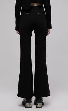 The Auryn Flares will have you feeling like everything golden and glamorous. The combo of sleek PU and soft stretch fabric creates sleek, flattering lines and a wicked contrast. The flares are high waisted for a modern, comfort fit and feature two tie details at the hips for a final classic touch. Pair with a blouse and heeled boots for chic corpgoth vibes. Fabric 1: 67% Viscose, 26% Polyamide, 7% Elastane Fabric 2: 56% PU, 44% Polyester Lining: 97% Cotton, 3% Elastane. Elegant Black Flares For Night Out, Chic High-waist Flares For Night Out, Chic High Waist Flares For Night Out, Black Bottoms With Flared Hem For Evening, Chic Fitted Flares For Night Out, Chic Flared Hem Bottoms For Evening, Sleek Flare Bottoms For Night Out, Elegant Black Pants With Flared Hem, Chic Party Flares With Flared Hem