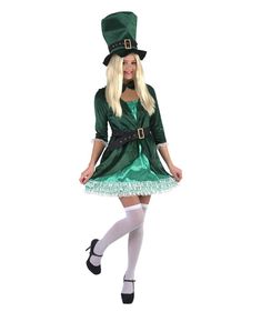 a woman dressed in a green lepreti dress and hat is posing for the camera