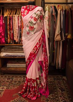 Khan Saab Boutique Designer Georgette Carnation Saree: Deshi Besh. Luxury Georgette Saree With Border, Luxury Zari Work Saree As Gift, Luxury Designer Saree With Motifs, Luxury Designer Wear Saree With Dabka Detailing, Luxury Saree With Motifs For Eid, Luxury Jamawar Saree With Dabka Work, Luxury Handwork Designer Saree, Luxury Zari Work Chinon Saree, Luxury Hand Embellished Georgette Saree