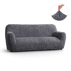 a gray couch with a hand reaching for it