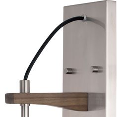 a metal and wood wall mounted light fixture