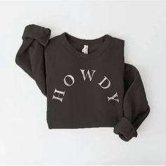 Introducing our "Howdy" sweatshirt, a cozy and cheerful garment that captures the heartwarming spirit of a Texan welcome. Remarkably soft, heather dust fabric spun from plush sponge fleece Hand screen-printed with water-based ink utilizing the technique of soft printing HOWDY is on the front center in white Comfortable, oversized fit with ribbed cuffs and waistband We can't keep this sweatshirt in stock! Made in the USA Guaranteed to be your favorite, go-to! Remember words have power and energy- Winter French Terry Soft-washed Sweater, Winter Soft-washed French Terry Sweater, Soft-washed French Terry Sweater For Winter, Winter Loungewear Sweatshirt With Screen Print, Cozy Black Sweater With Letter Print, Black Crew Neck Soft-washed Sweatshirt, Black Soft-washed Crew Neck Sweatshirt, Loungewear Sweater With Letter Print In French Terry, Fall Fleece Sweatshirt With Screen Print