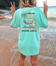 "These cute beachy, distressed tees make a perfect beach coverup or lounge tee! Or mix and match colors with friends for a perfect group vacation photo! Please note that this design comes in black ink only, and is only on the back of the tshirt! About Comfort Colors Tees! (Unisex Shirts!) These ultra soft pigment dyed shirts are one of our best sellers ⭐️ 100% ring spun cotton ⭐️ PRESHRUNK, soft-washed, garment-dyed fabric ⭐️ Set-in sleeves ⭐️ Double-needle stitched sleeves and bottom hem ⭐️ Twi Relaxed Summer Loungewear T-shirt, Relaxed Summer T-shirt For Loungewear, Soft-washed Summer Beach T-shirt, Summer Loungewear Top With Crew Neck, Summer Crew Neck Top For Loungewear, Casual Pre-shrunk T-shirt For Beach, Casual Crew Neck T-shirt For Vacation, Oversized Casual T-shirt For Beach Season, Casual Short Sleeve T-shirt For Beach Season