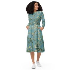 Meet your new favorite dress! Its soft fabric and flattering cut will ensure you feel comfortable and feminine all day long. Plus, the fitted waist and flared bottom part of the dress will accentuate the wearer's naturally beautiful silhouette. The best part about the dress? It. Has. Pockets.   * 95% polyester, 5% elastane (fabric composition may vary by 1%)  * Premium knit mid-weight jersey fabric  * Midi length  * Long sleeves  * Side pockets  * Boat neckline  * Fitted on the waist  * Flared bottom part This product is made custom and specially for you as soon as you place an order, which is why it takes us a bit longer to deliver it to you as well as why we can not accept returns. Making products on demand instead of in bulk helps reduce overproduction, so thank you for making thoughtfu Modest Long Sleeve Flowy Midi Dress, Modest Long Sleeve Spring Dresses, Modest Long Sleeve Dress For Spring, Flowy Long Sleeve Dress For Spring, Flowy Long Sleeve Midi Dress For Fall, Blue Long Sleeve Midi Dress For Spring, Casual Long Sleeve Midi Dress With Relaxed Fit, Casual Long Sleeve Relaxed Fit Midi Dress, Flowy Long Sleeve Midi Dress With Floral Print