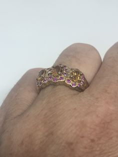 Unusual cut of citrine surrounded by pink tourmaline Sterling Filigree gold finished Setting Handmade Size 5.5 Can be resized, my jeweler charges a $10 fee All rings are shipped in a nice gift box. Check out our over a THOUSAND great reviews Engraving is $4 per letter and is not always perfect depending on the piece. It can take a few days if the jeweler is busy. This is payable to Paypal Judithsltd@gmail.com Gothic Ring, Gothic Rings, Vintage Heart, Heart Locket, Red Garnet, Pink Tourmaline, 925 Sterling Silver Ring, Lovely Gift, Vintage Rings