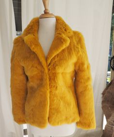 A CLASSIC STYLE IN VIBRANT NEW SEASONS MUSTARD YELLOW THE EFFECT IS SUPERB THIS IS A BEAUTIFULLY MADE FULLY LINED TIMELESS STYLE RABBIT FUR JACKET TEAM IT WITH JEANS FOR CASUAL CHIC STYLE IT FOR EVENING ON THESE WINTER NIGHTS  A LOVELY COLOUR A BEAUTFUL COAT  All my rabbit fur is ethically sourced and a by product of the meat industry Luxury Mustard Winter Outerwear, Yellow Fur Coat, Yellow Rabbit, Rabbit Fur Jacket, Basic Jackets, Casual Chic Style, Rabbit Fur, Season Colors, Fur Jacket