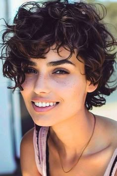 Grown-out Pixie with Long Bangs Short Curly Hairstyle. Short Curly Edgy Hairstyles, Short Natural Wavy Hairstyles, Grown Out Pixie With Bangs, Short Hair Styles For Curly Hair Over 50, Growing Out Curly Pixie, Updo For Short Curly Hair, Curly Pixie Cuts Naturally, Wavy Short Hair With Bangs, Very Short Curly Hair Pixie