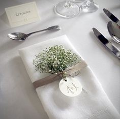 a table set with silverware and napkins