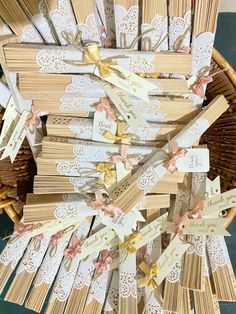 many small wooden tags in a basket on the floor with ribbons tied to them and placed next to each other