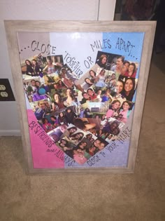 a collage of photos is displayed in a frame on the floor next to a wall