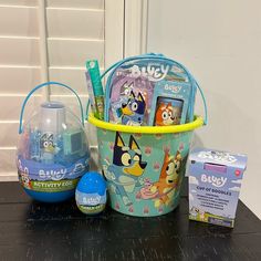 an assortment of children's toys sitting on a table